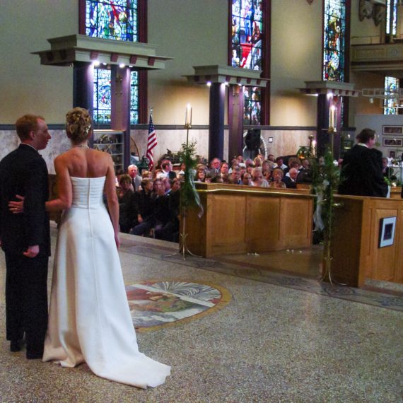 A couple turns around to the congregation freshly married