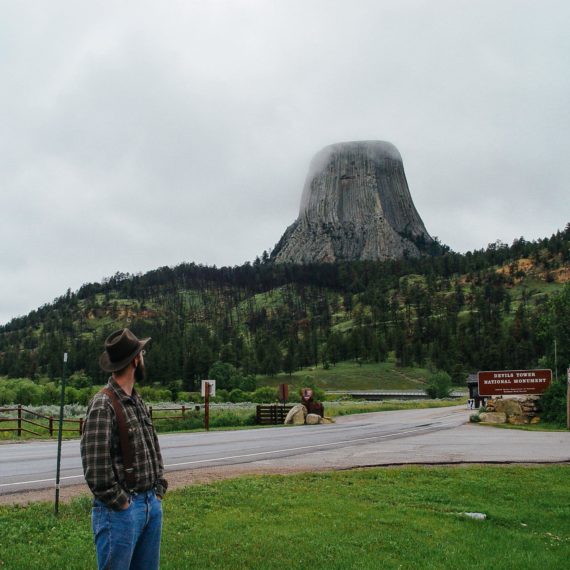 Man looking at Devil’s Tower