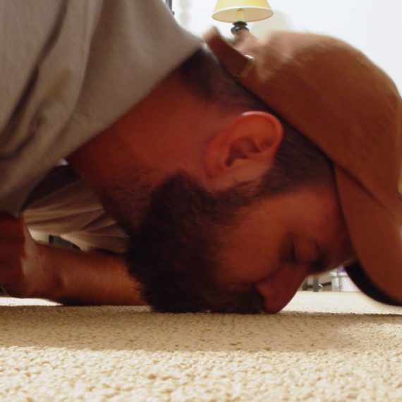 Man kissing carpet