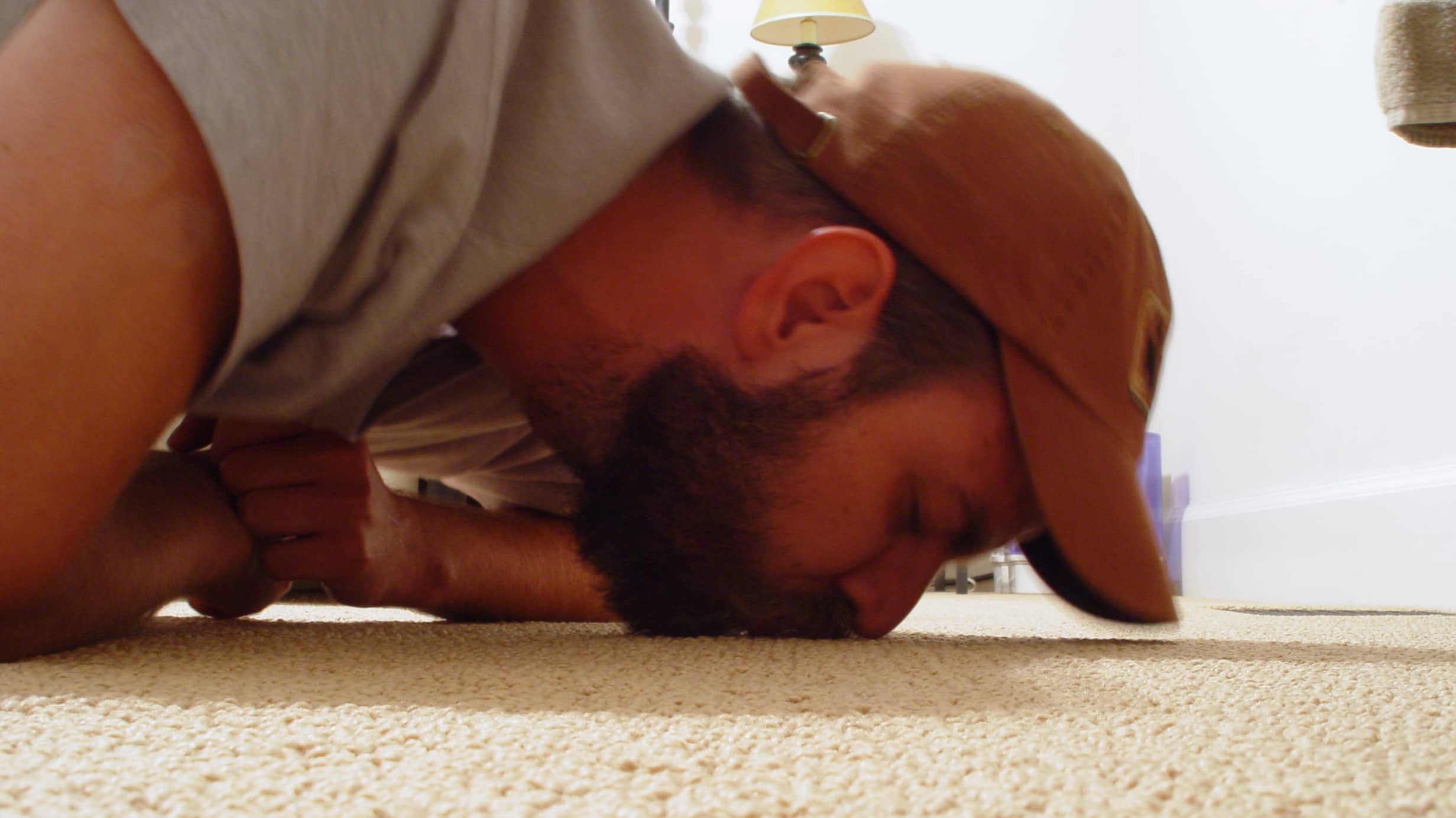 Man kissing carpet