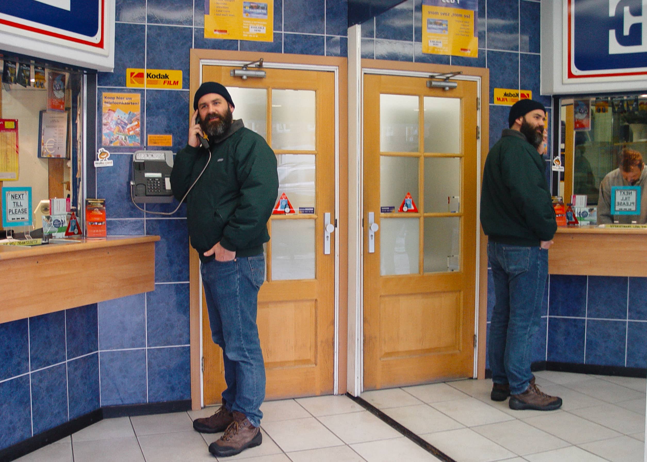 Bearded man at payphone in automat