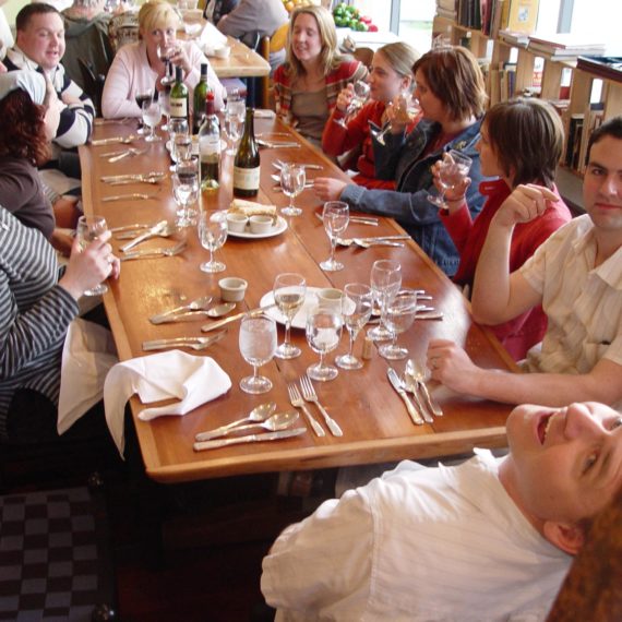 Folks having dinner around a table