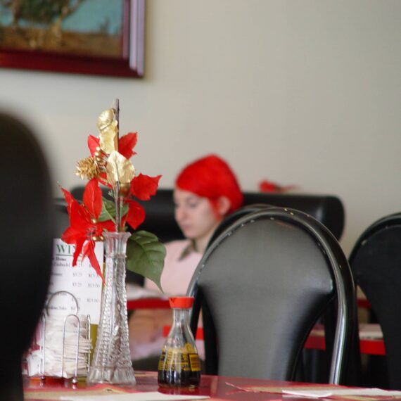 Person with red hair at Chinese restaurant