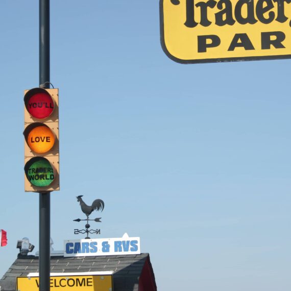 Traders World parking sign and stoplight