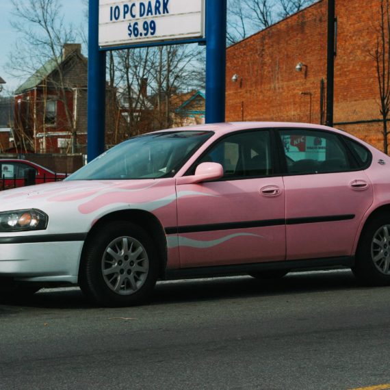 Pink Chevy Impala with white flames