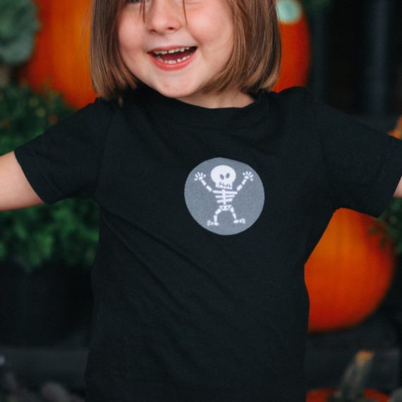 Young person wears t-shirt with skeleton design