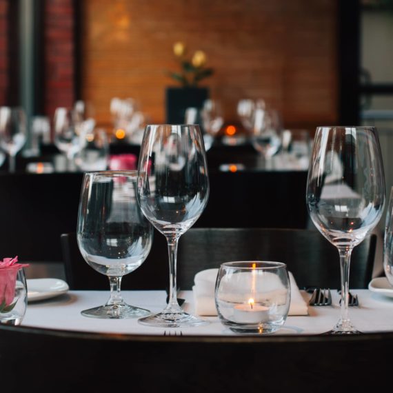 Wine glasses set on tables at BOCA in Oakley