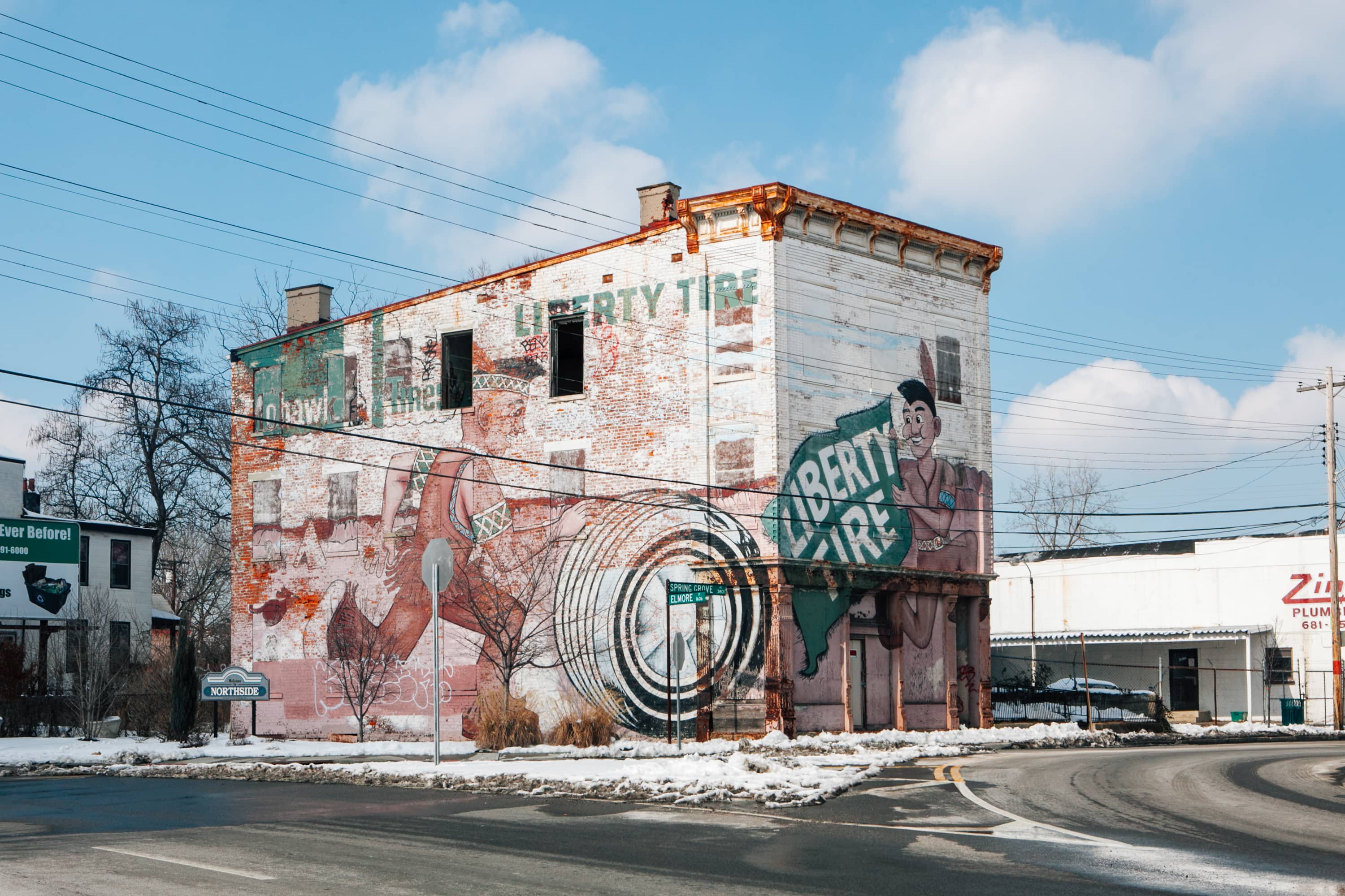 Liberty Tire building with mural of Indian characters and tire