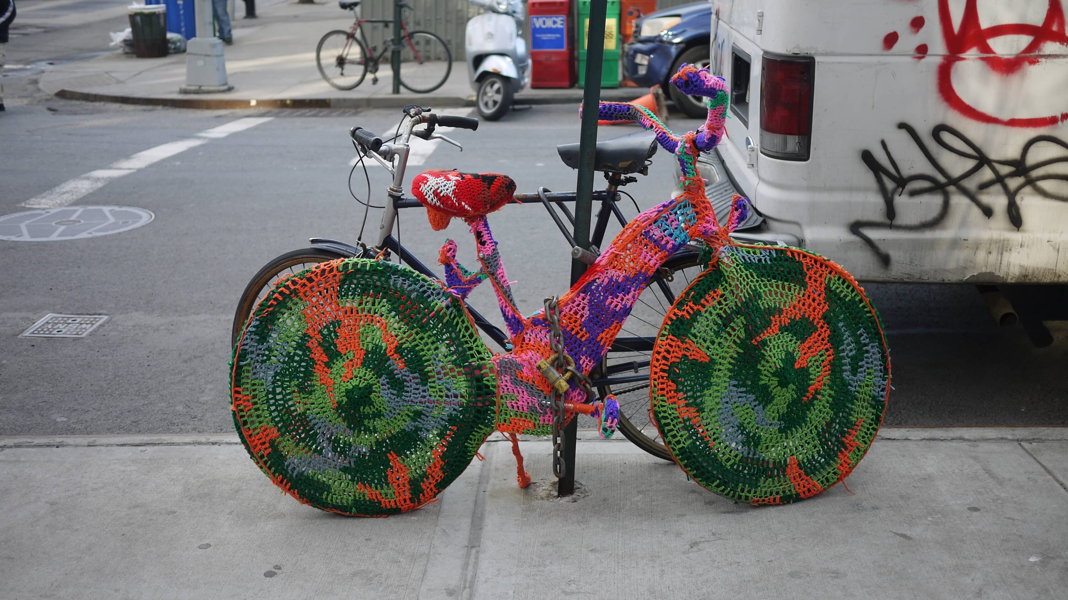 (insert a knitted installation, it can't possibly be a usably bike cover, but man it's pretty)