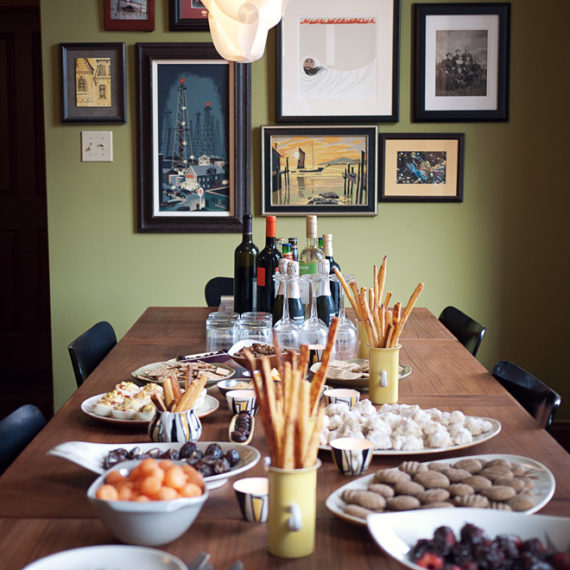 A spread of food and a wall of art