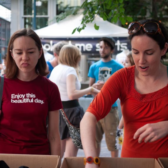 folks shopping for t-shirts