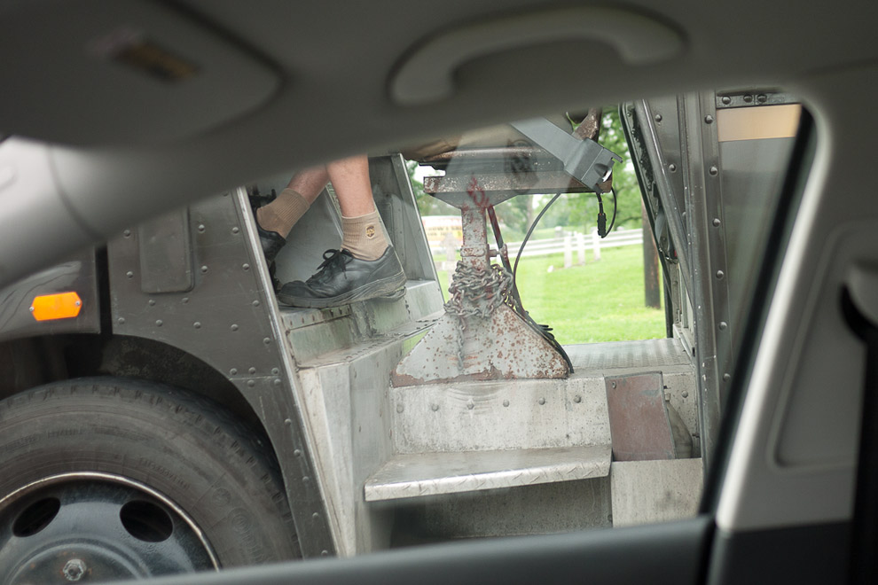 A snapshot of a UPS drivers feet on the pedals of the UPS truck