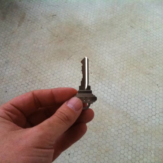 Person holding key