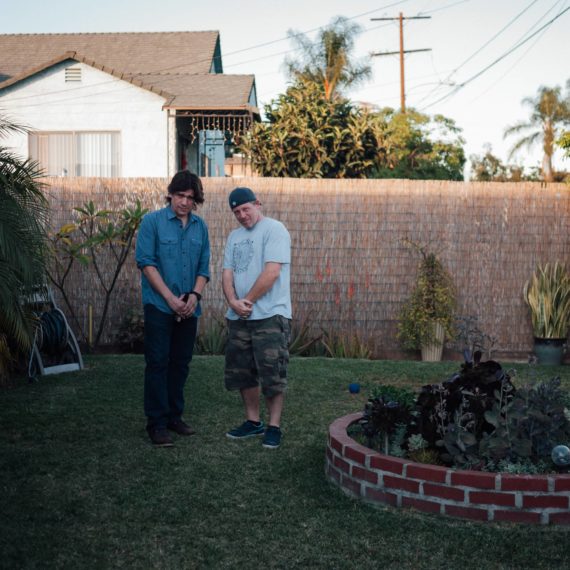 Two men in backyard