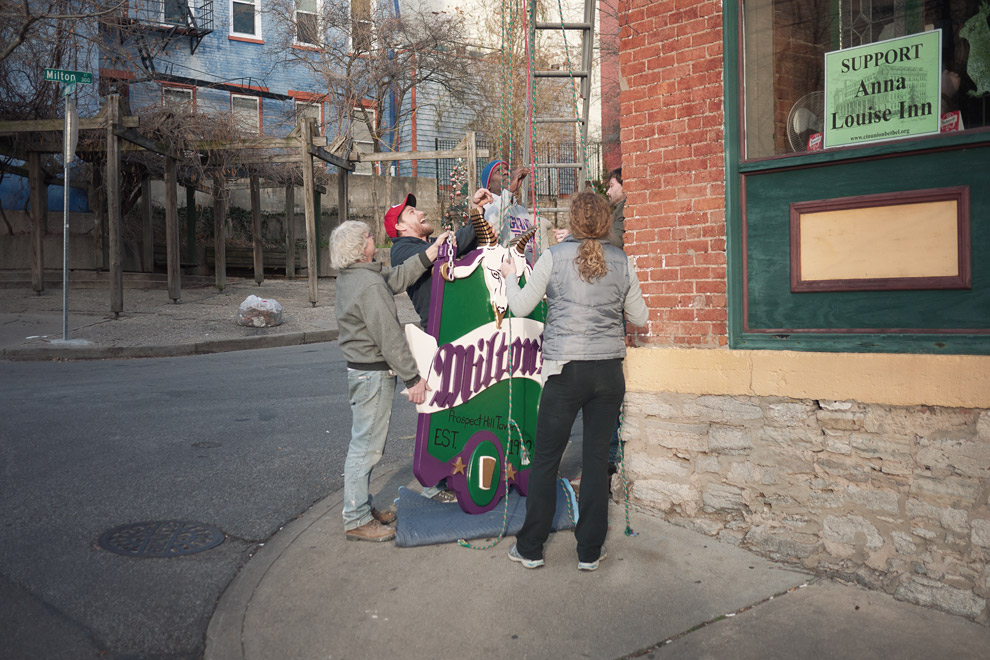 Getting ready to hoist a new sign outside of a bar