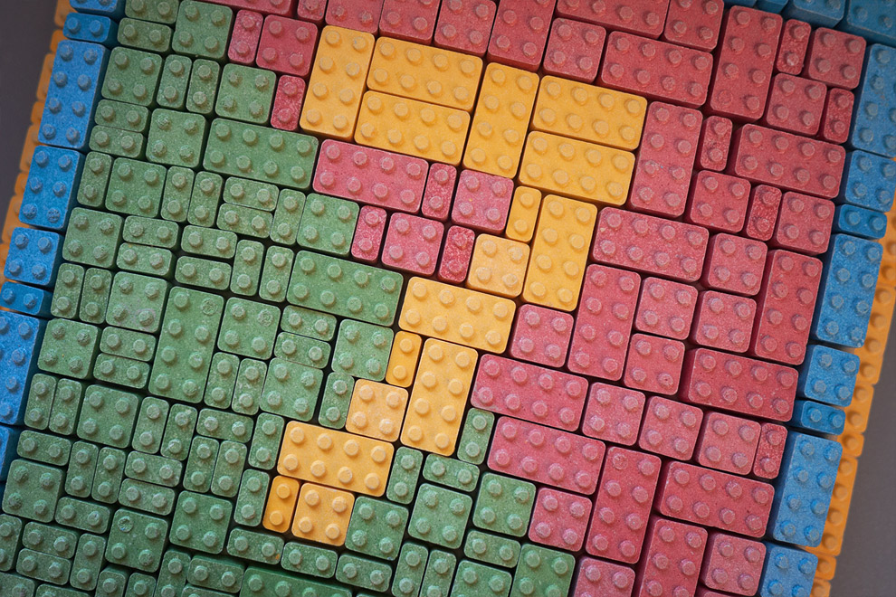 The number seven written out in Lego tiles made from sugar on a cake