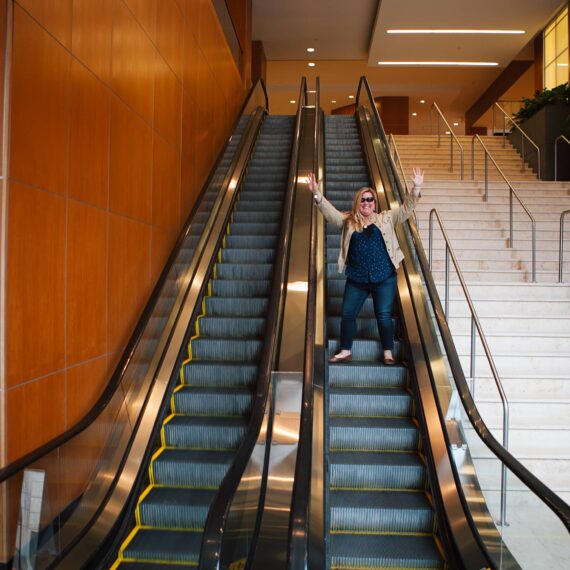 Woman on escalator