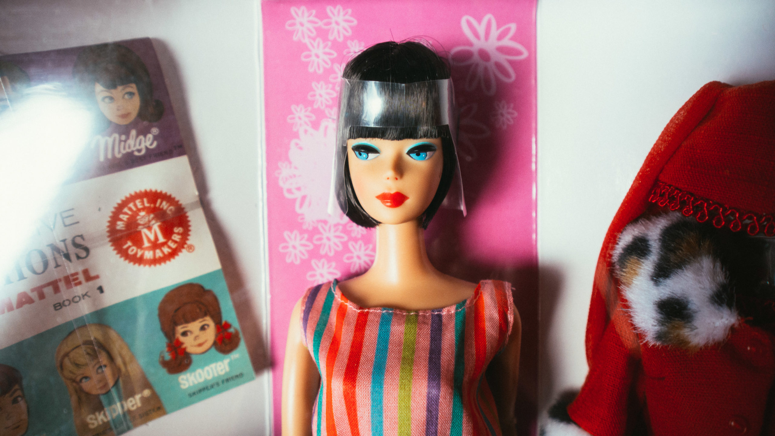 A Barbie doll, partially still in her box