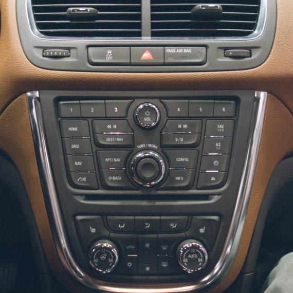 A car dash with lots of button