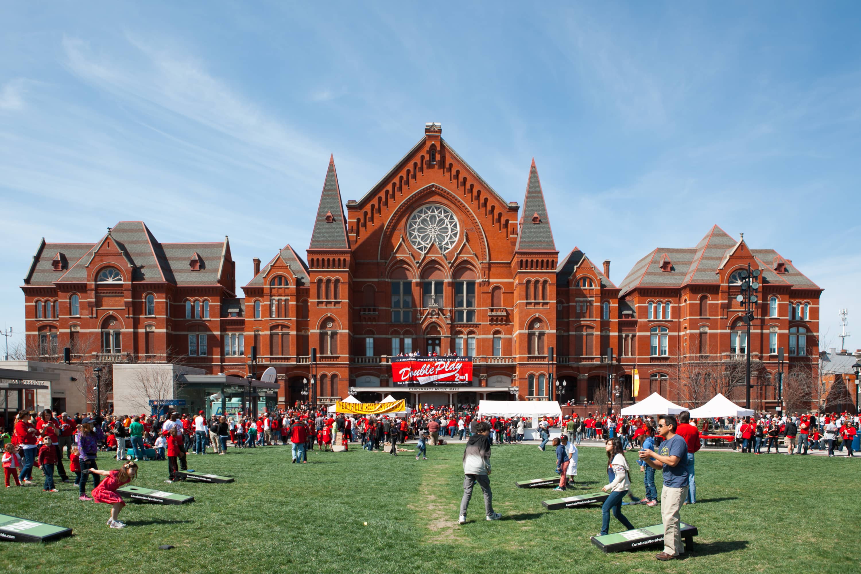 Folks play games in front of Music Hall on Red's Opening Day