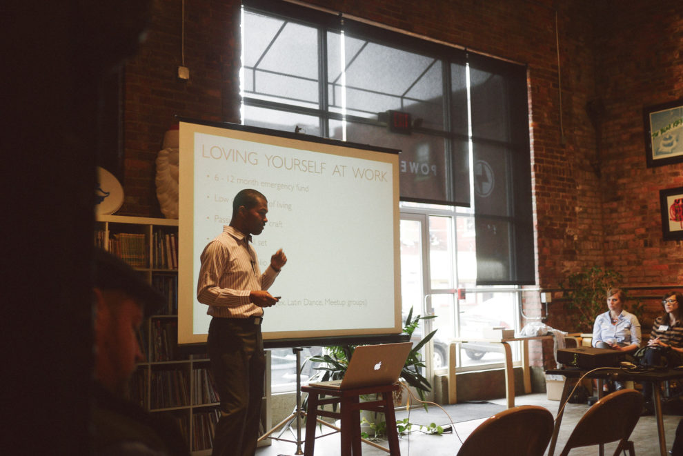 A man gives a presentation about loving yourself at work