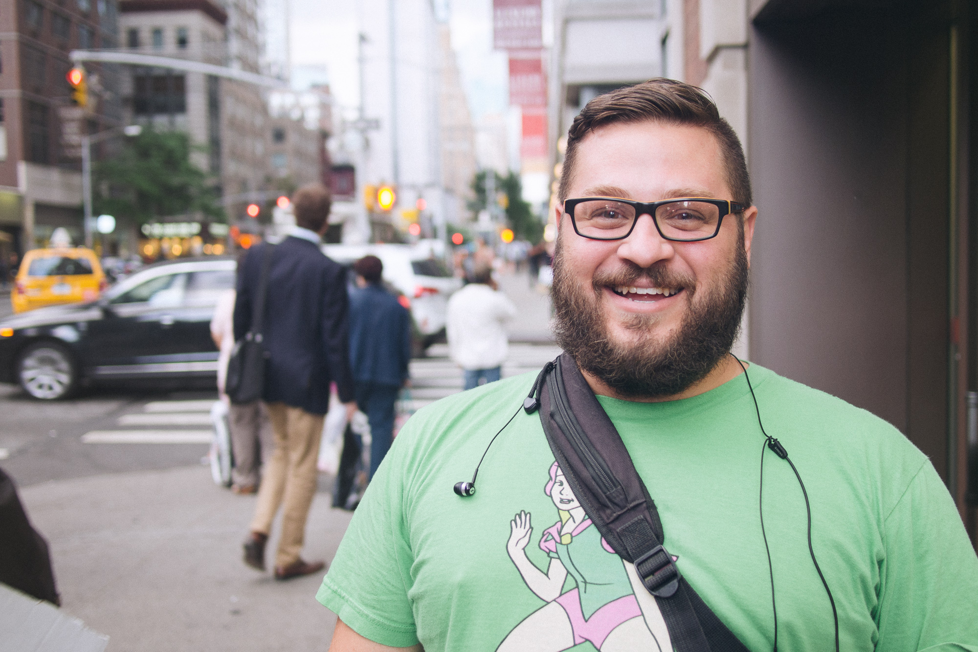 A man smiling in a green t-shirt