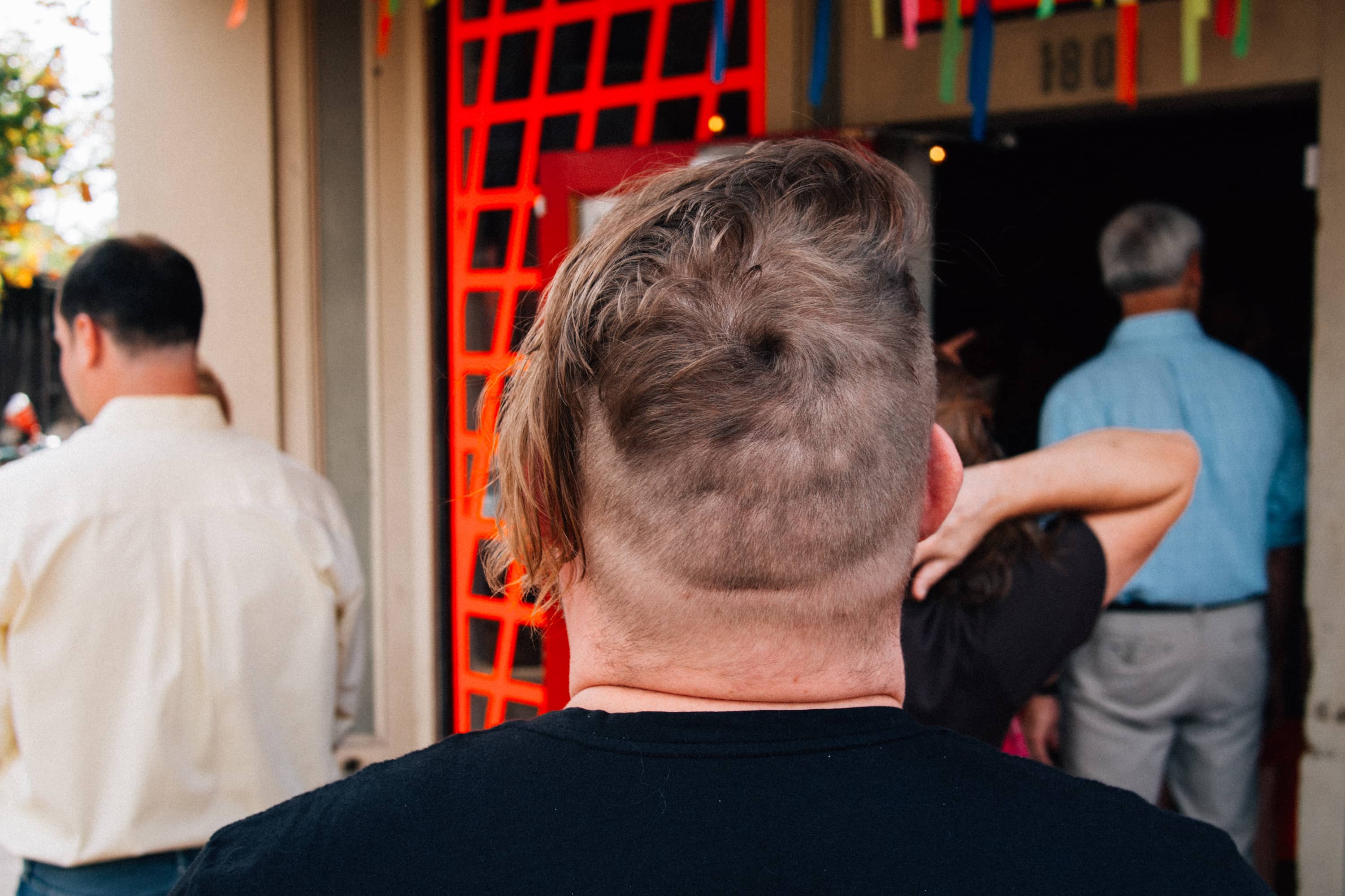 An asymmetrical haircut from behind