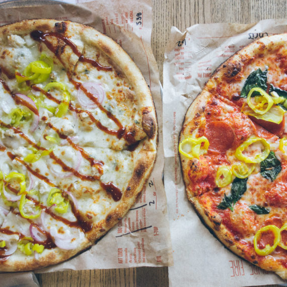 Two pizzas with different toppings