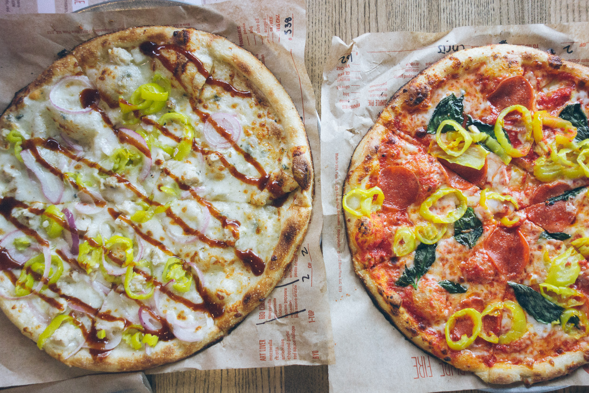 Two pizzas with different toppings