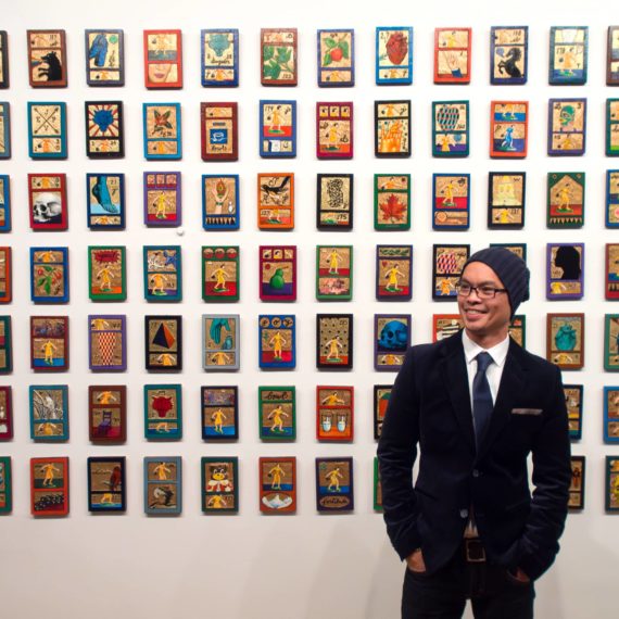 Man standing in front of art he created