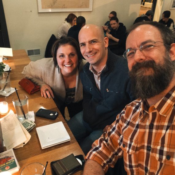 Three friends grab dinner at a bar restaurant