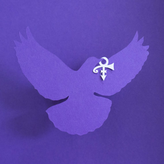 A purple dove and Prince symbol made of cut paper