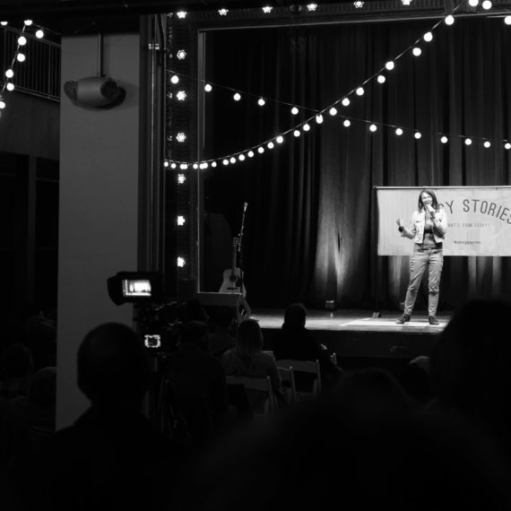 Black and white photo of a woman on stage