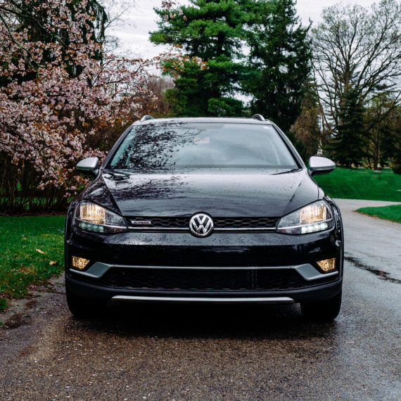 A black VW car photographed from the front