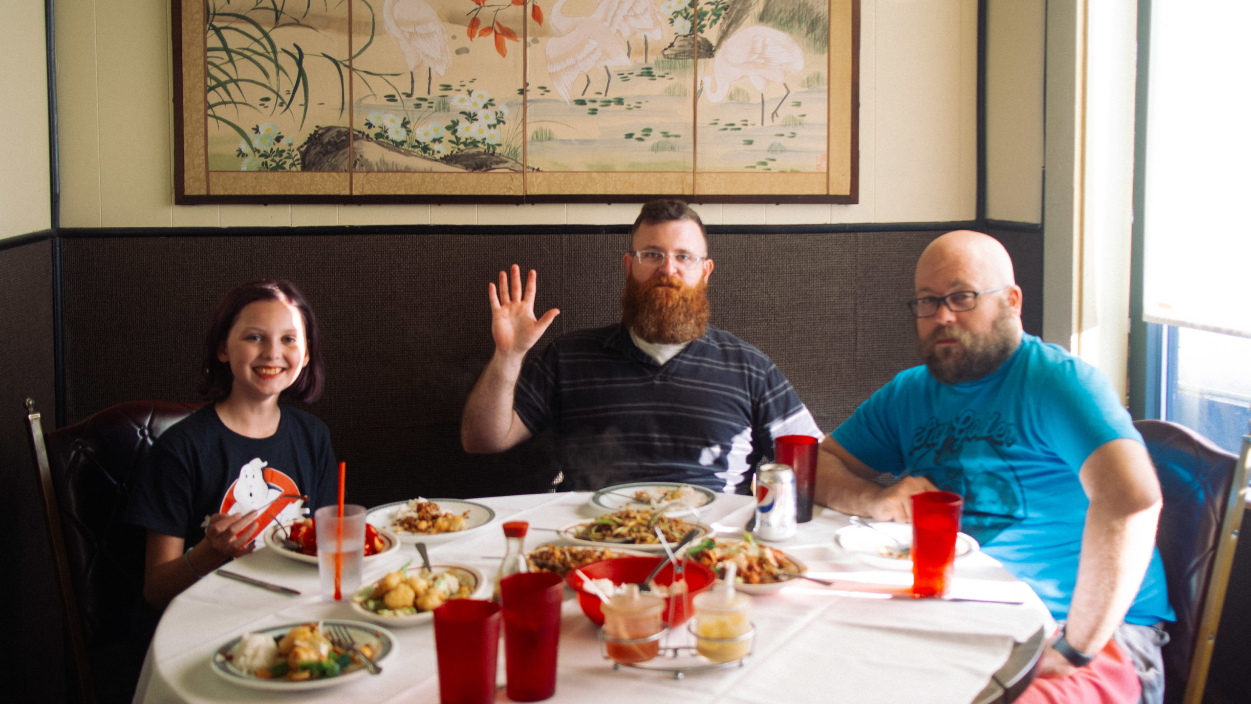 three diners at a Chinese restaurant