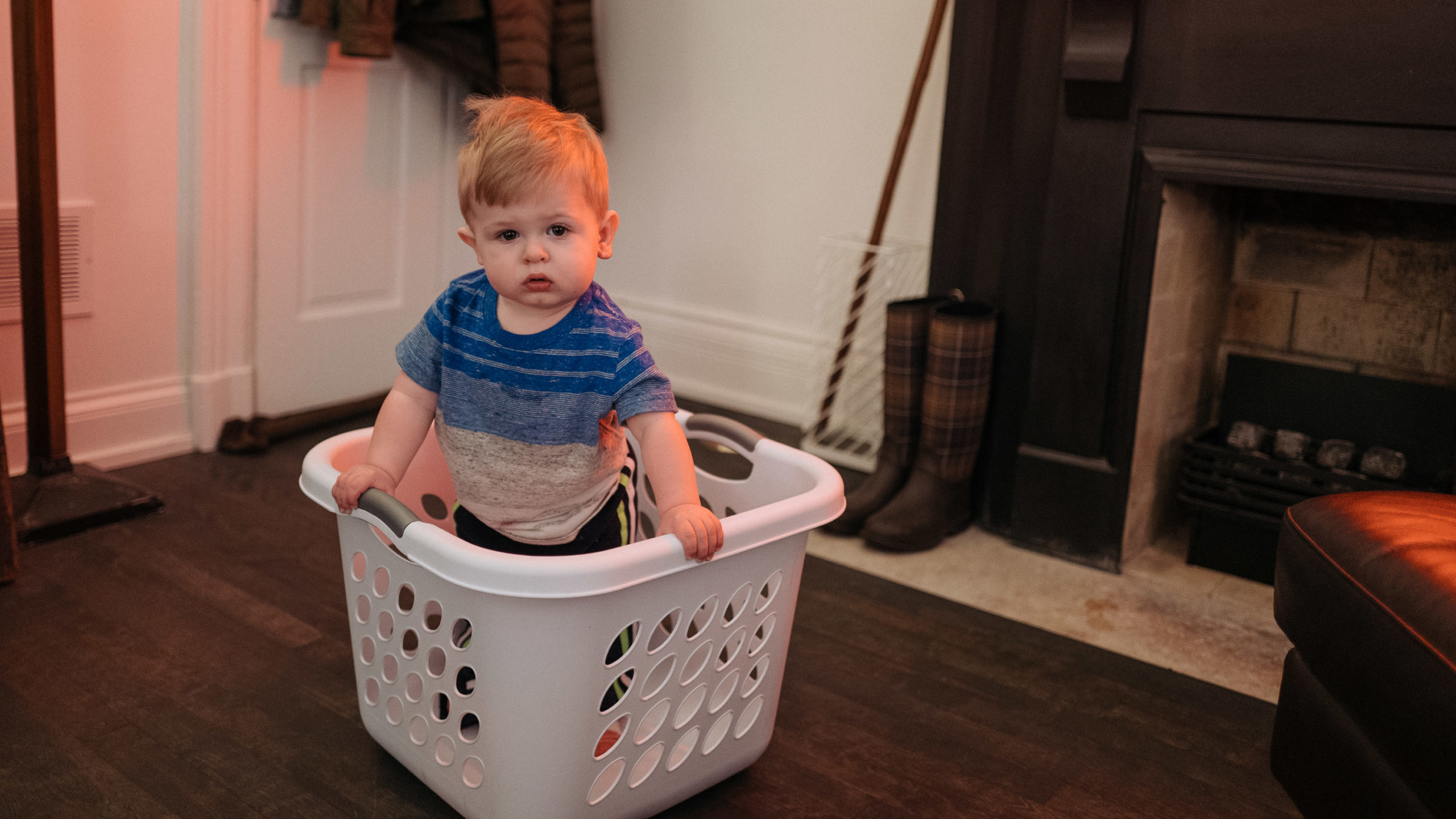 boy in laundry basket