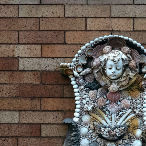 A fountain covered in shells