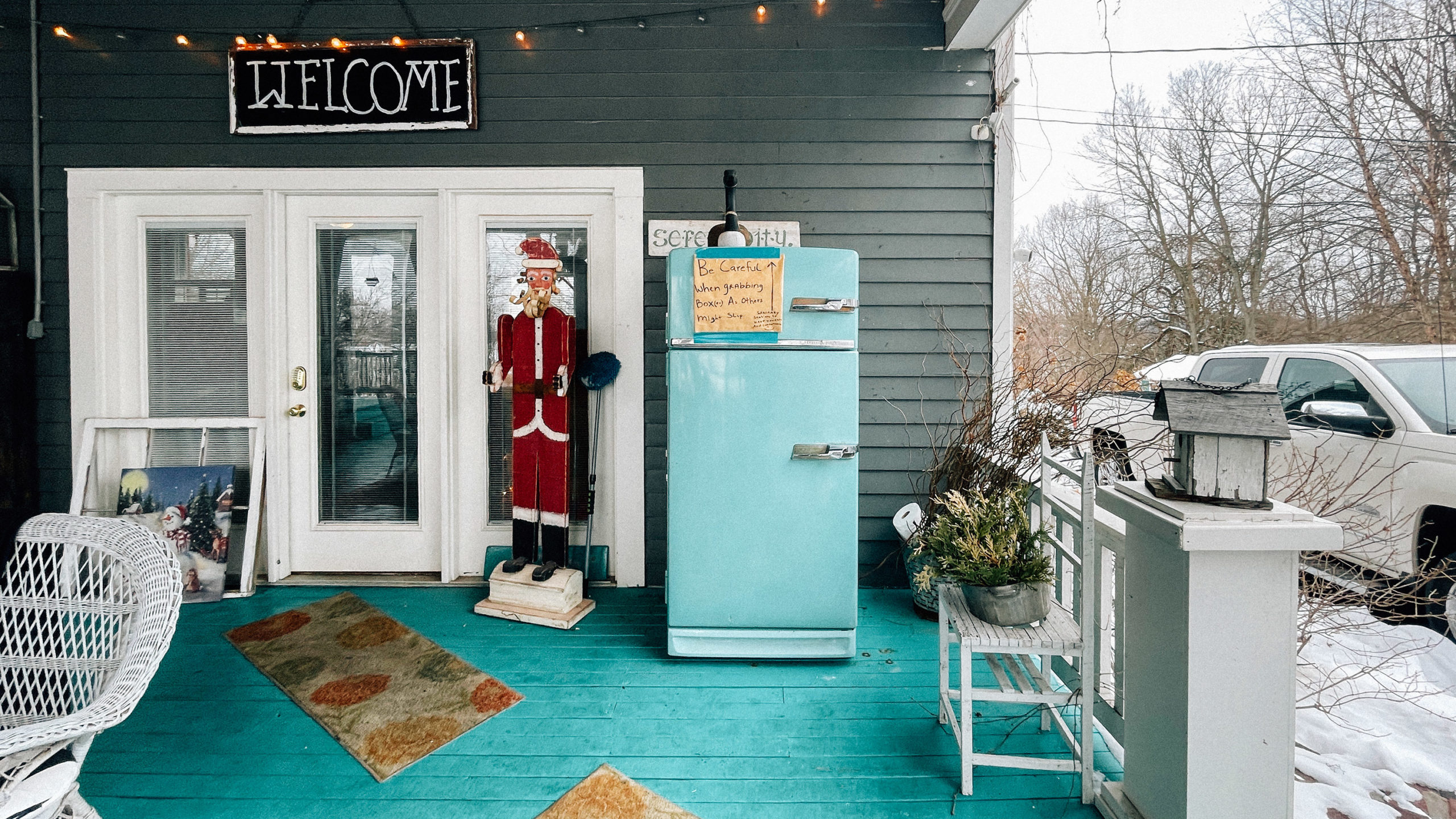 a teal fridge that contains donuts