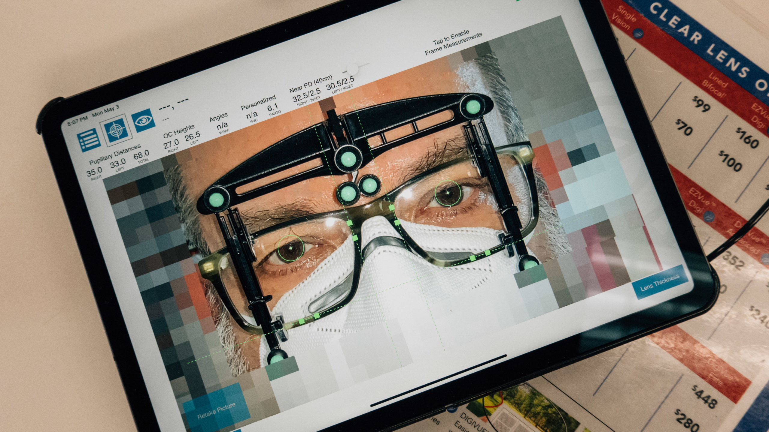 A tablet with an app determining pupillary distance for eyeglasses