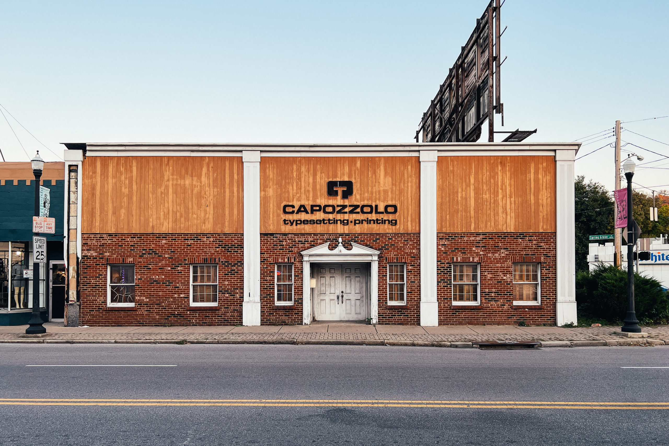 A building with a sign that reads Capozzolo