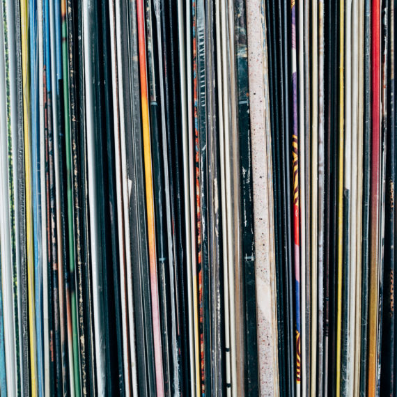 A box full of records, only the tops are visible, not the spine