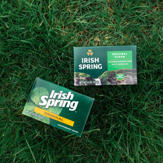 Two boxes of Irish Spring soap on some grass with different package designs.