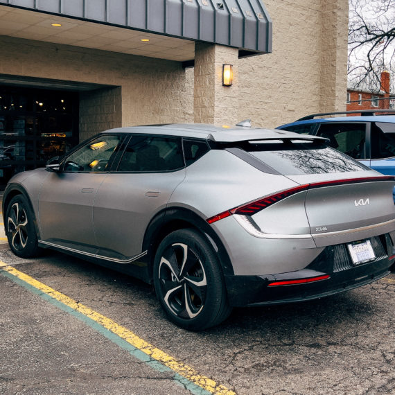 A sporty gray electric car in a parking lot