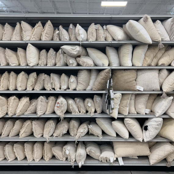 Shelves full of beige pillows