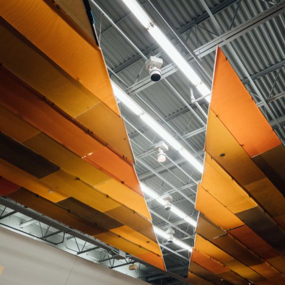 Orange panel features to diffuse light inside a mall