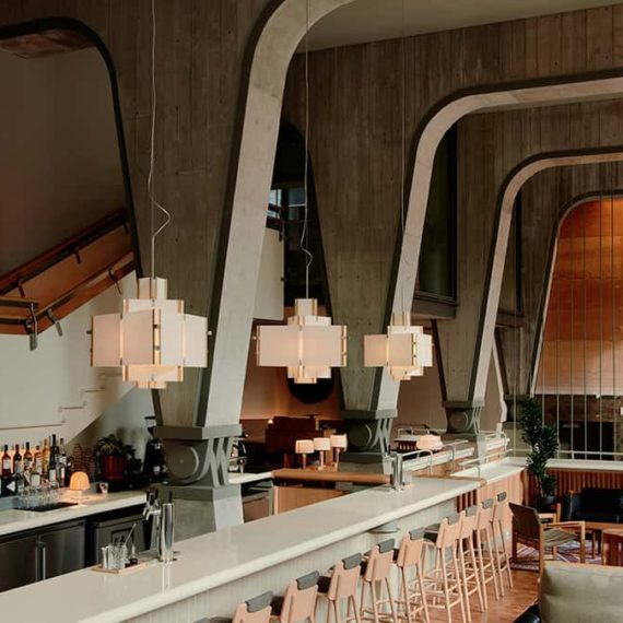 A modern hotel bar interior with concrete forms