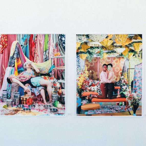 Two large scale portraits by artist Leonard Suryajaya intricately staged with colorful fabrics and decor and colorfully outfitted subjects.