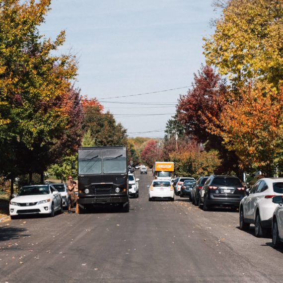 A UPS truck on a street during Autumn