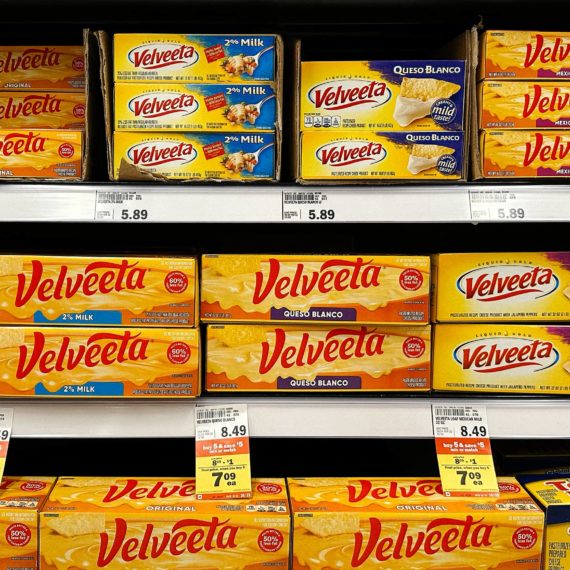 Velveeta cheese varieties fill the shelves in a grocery store