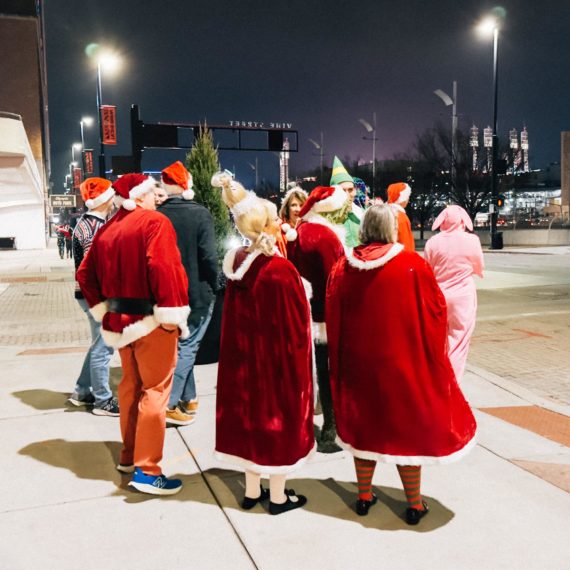 People dressed in Santa inspired outfits